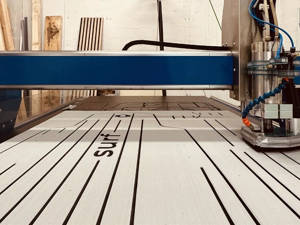 CNC machine milling a DEXLIT deck module in the Lübeck workshop